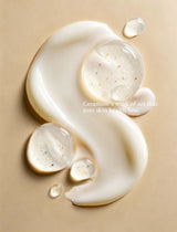 Ceramine Vitamin Cleansing Milk texture swatch: silky white milk with clear droplets of vitamin beads